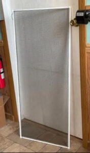 Screen for a door or tall window.