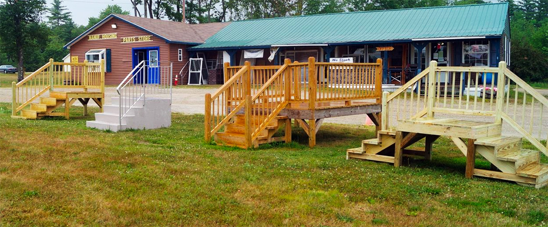 Multiple styles of mobile home stairs displayed outside of the MHP&P building.